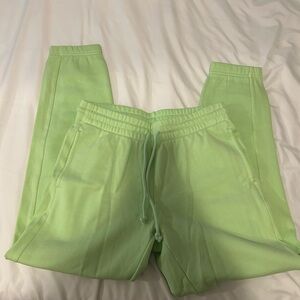 TNA “cozy af” neon green sweats